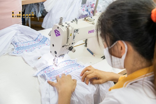 How elaborately a smocked dress is made by hands 